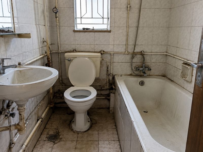 Bathroom plumbing before transformation project